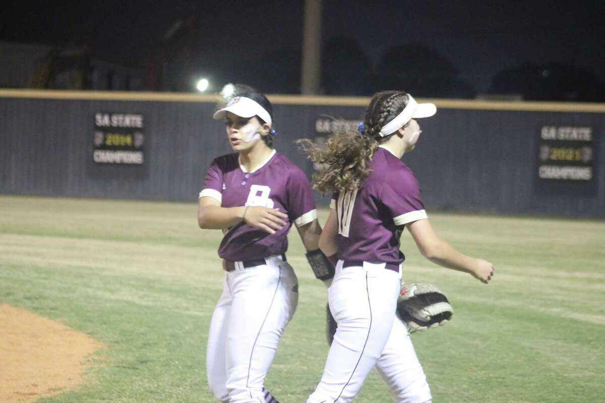 Deer Park right fielder Lindsey McKnight receives congratulations from second baseman Kayla Zaid after McKnight ran down a shallow fly ball in the sixth that went in the books as a sacrifice fly. But seconds later, Dobie was tying the game at 4-4.