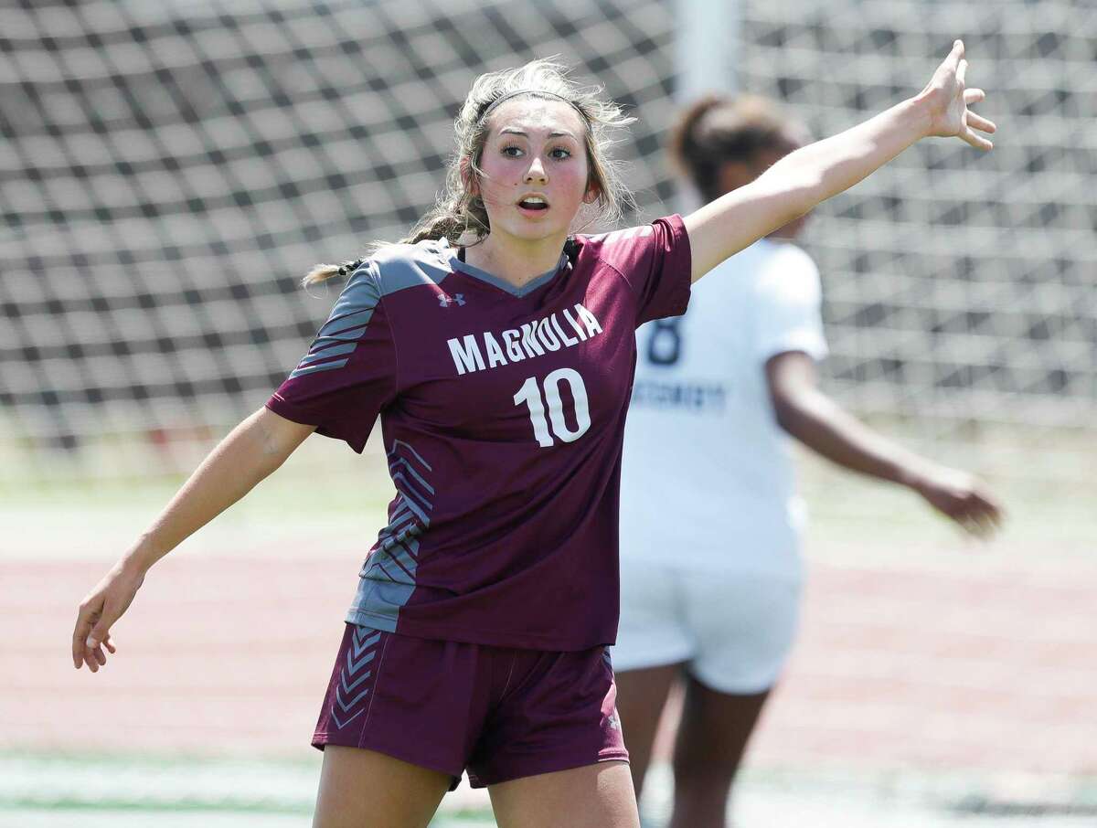 Magnolia’s Laney Gonzales (10) signals for possession in the second half of a Region III-5A semifinal high school soccer match at Turner Stadium, Friday, April 8, 2022, in Humble.