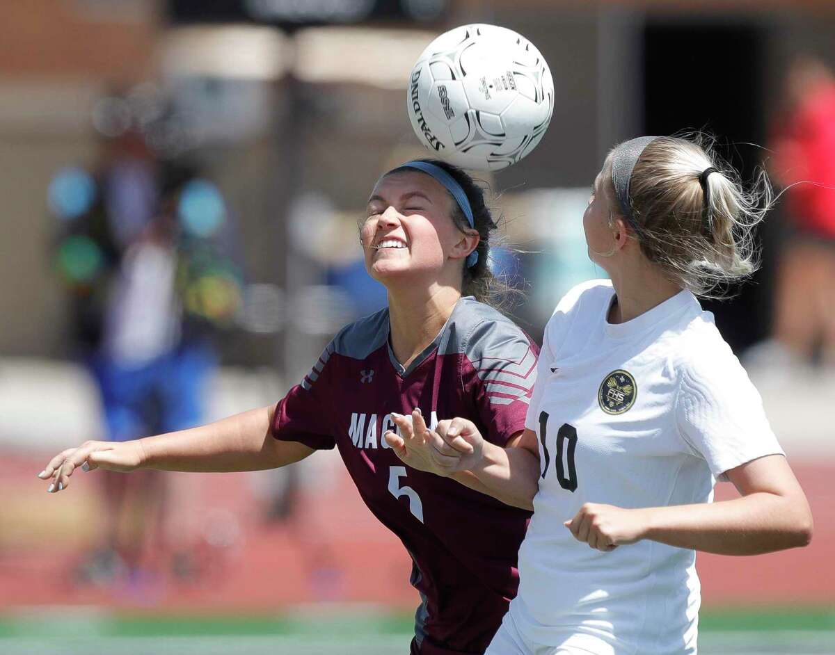 Magnolia’s Avery Tindall (5) heads the ball against Foster's Angelica Bochus (10) in the second half of a Region III-5A semifinal high school soccer match at Turner Stadium, Friday, April 8, 2022, in Humble.