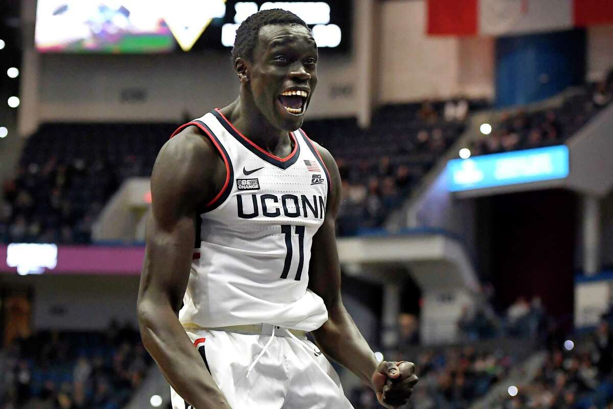 Connecticut's Akok Akok reacts in the first half of an NCAA college basketball game against Coppin State, Saturday, Nov. 13, 2021, in Hartford, Conn. (AP Photo/Jessica Hill)