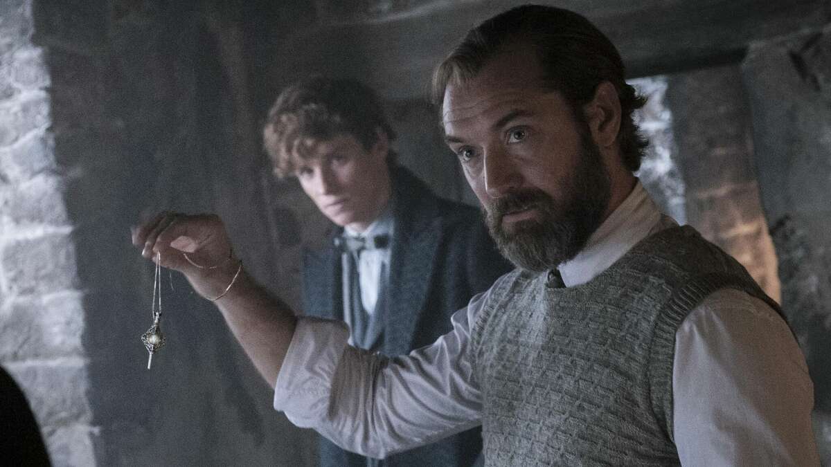 Albus Dumbledore (Jude Law, foreground) looks like he's trying to hypnotize someone in "Fantastic Beasts: The Secrets of Dumbledore" as Newt Scamander (Eddie Redmayne) looks on. According to our review, there's an even easier way to put the audience to sleep.  
