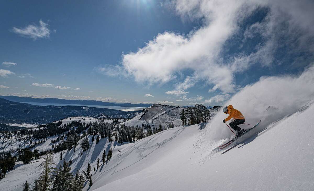 A skier carves fresh snow at Palisades Tahoe ski area in North Lake Tahoe on April 12, 2022.
