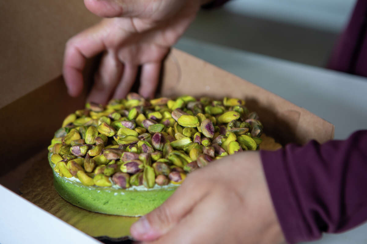 Monique Feybesse displays a pistachio tart made earlier that morning in her home kitchen in Vallejo, Calif., on April 8.