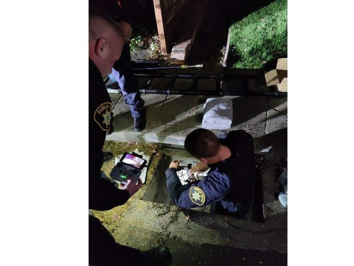 Alameda County sheriff's deputies work to rescue ducklings stranded in a storm drain with the use of a drone.