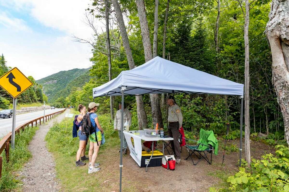 n recent years, local organizations and the town of Keene have stationed stewards at key trailheads. The Adirondacks and Catskills are slated for $8 million for visitor safety and wilderness protection in the $220 billion state budget legislators passed on Saturday. (Photo Mike Lynch / Adirondack Explorer)