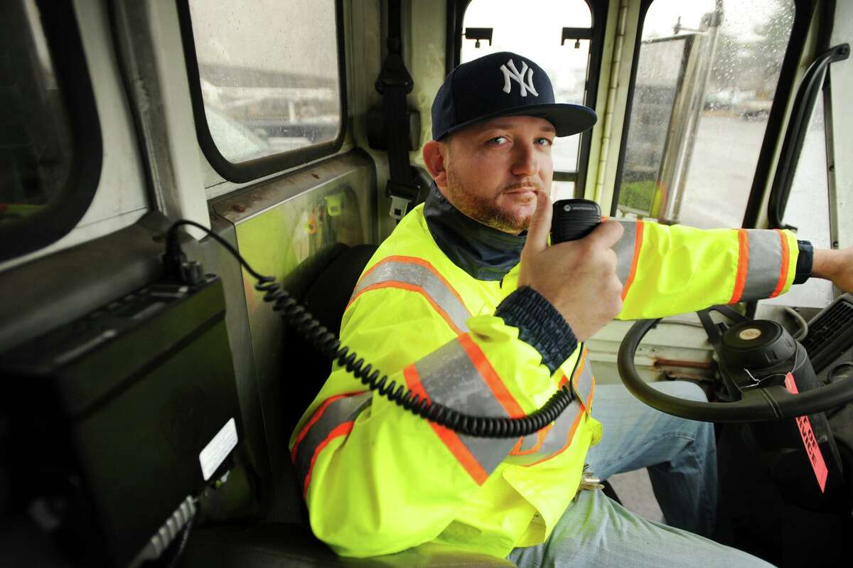 Roadway foreman Craig Nadrizny shows the new radio system employed in the city's snow removal and emergency operations equipment at the Public Facilities Municipal Garage in Bridgeport, Conn. on Wednesday, November 27, 2013.