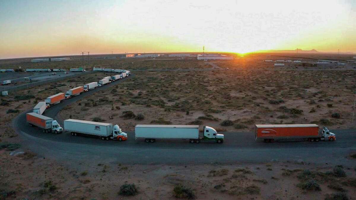 Truckers block the entrance into the Santa Teresa Port of Entry in Ciudad Juarez going into New Mexico on April 12, 2022. The truckers blocked the port as a protest to the prolonged processing times implemented by Gov. Abbott which they say have increased from 2-3 hours up to 14 hours in the last few days. (Omar Ornelas /The El Paso Times via AP)