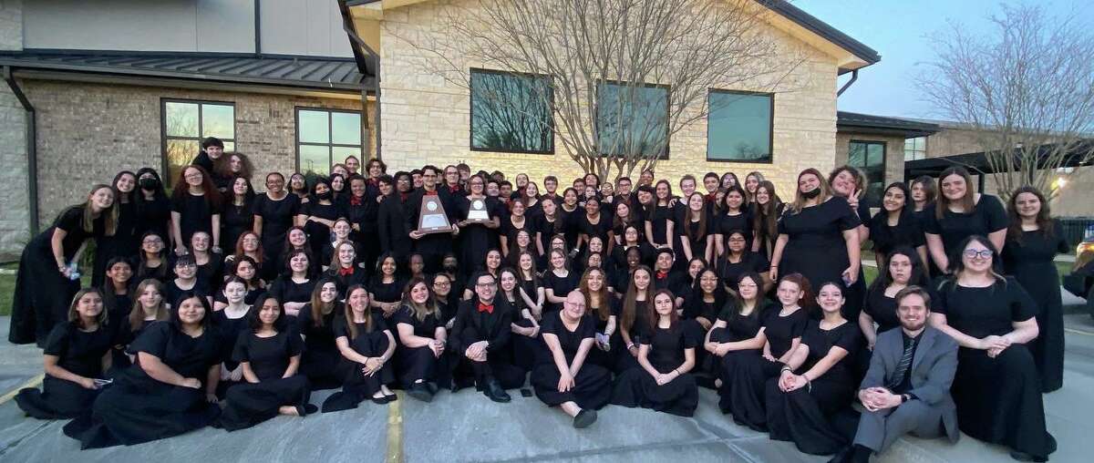 Alvin High School choir members hold awards received at the 2022 UIL Concert and Sight-Reading Evaluation.