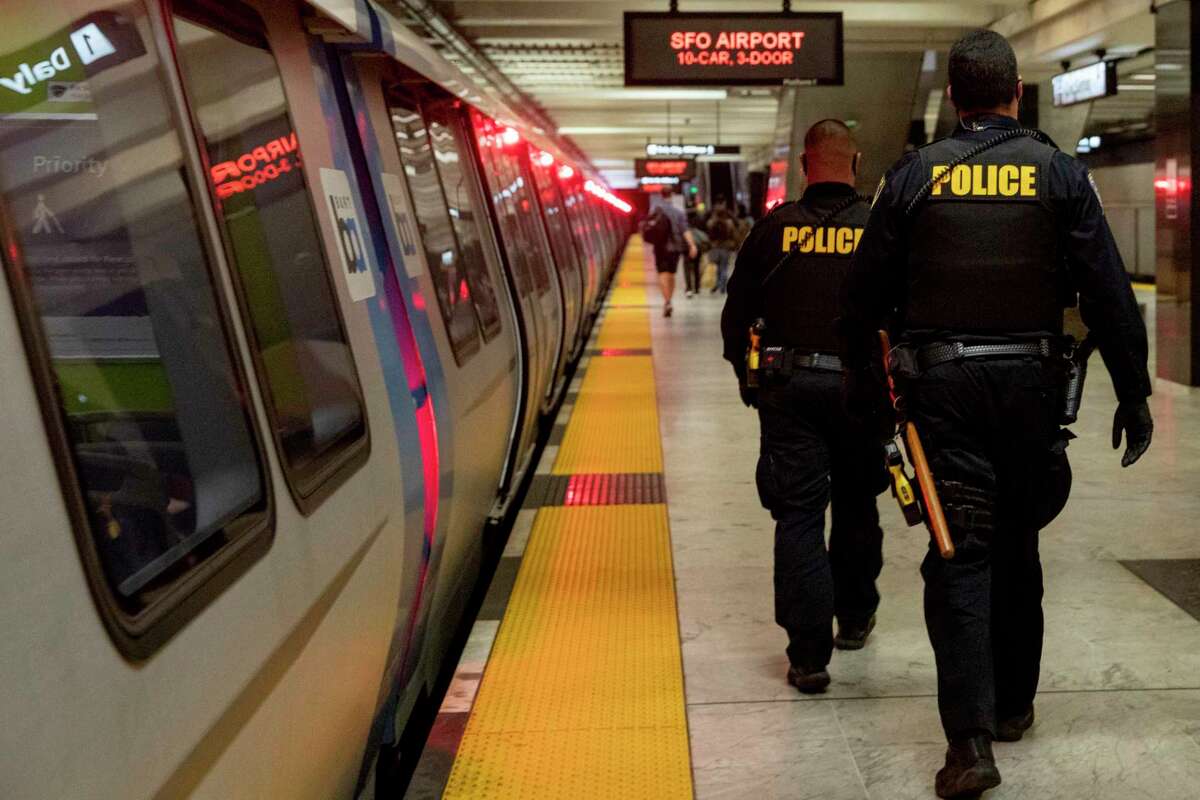 BART police officers patrol the Civic Center Station platform in San Francisco.