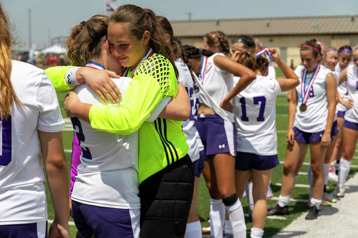 Boerne keeper Kinsley Sawyer embraces forward Sophia Harper (2) after falling 3-0 to Celina during a Class 4A girls soccer semifinal in Georgetown, Wednesday, Apr., 13, 2022.