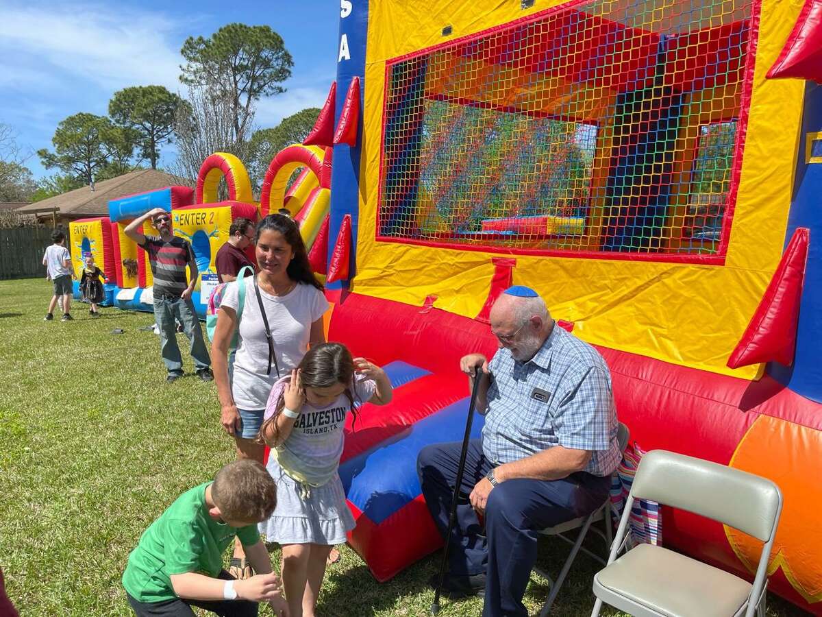 Congregation Shaar Hashalom Rabbi Stuart Federow, right, manages a bounce house March 27 at the Clear Lake Community Purim Carnival. Purim, as told in the Bible’s book of Esther, celebrates the deliverance of Persia’s Jewish people from Haman, an official of the Achaemenid Empire who was planning to have them killed. Learn more at www.shaarhashalom.org.