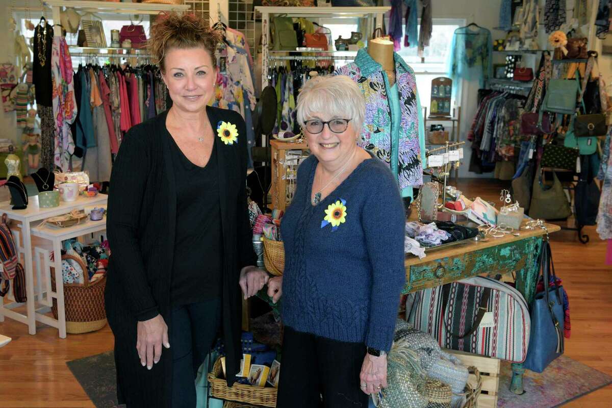 Jill Kerpchar-Rosenfield, left, and Nancy O’Connell have teamed up to benefit the Save the Children’s Ukrainian crisis relief fund through the sale of sunflower pins and notecards.
