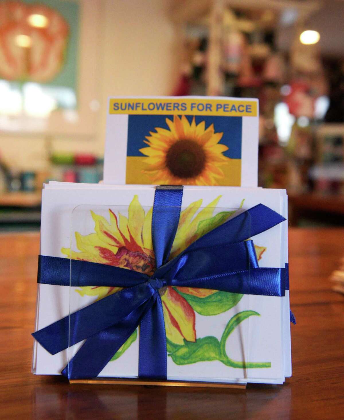 Jill Kerpchar-Rosenfield and Nancy O’Connell have teamed up to benefit the Save the Children’s Ukrainian crisis relief fund through the sale of sunflower pins and notecards. Wednesday, April 13, 2022, Ridgefield, Conn.
