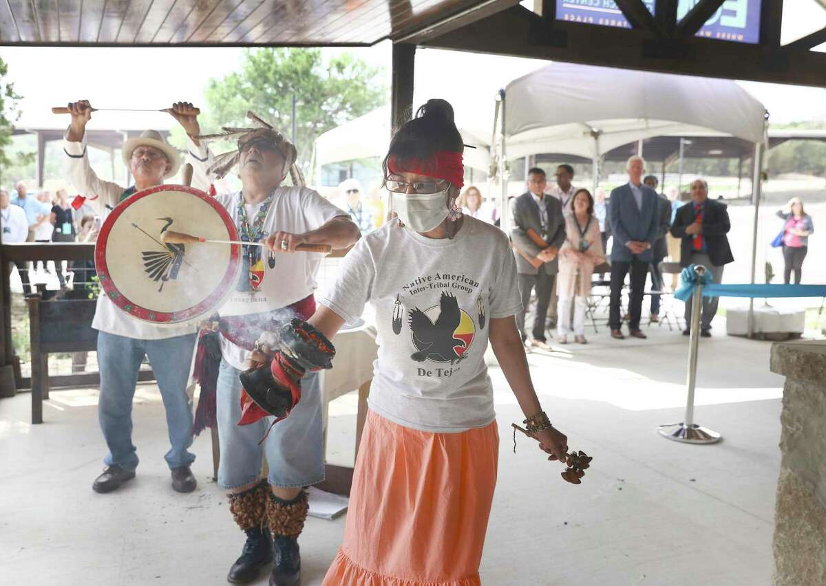 Members of Native American Inter-Tribal Group perform a ceremonial blessing on Wednesday at the unveiling of the Edwards Aquifer Authority Education Outreach Center. Pictured, from center to left, are Barbara Hernandez, John Hernandez and Vincent Huizar.