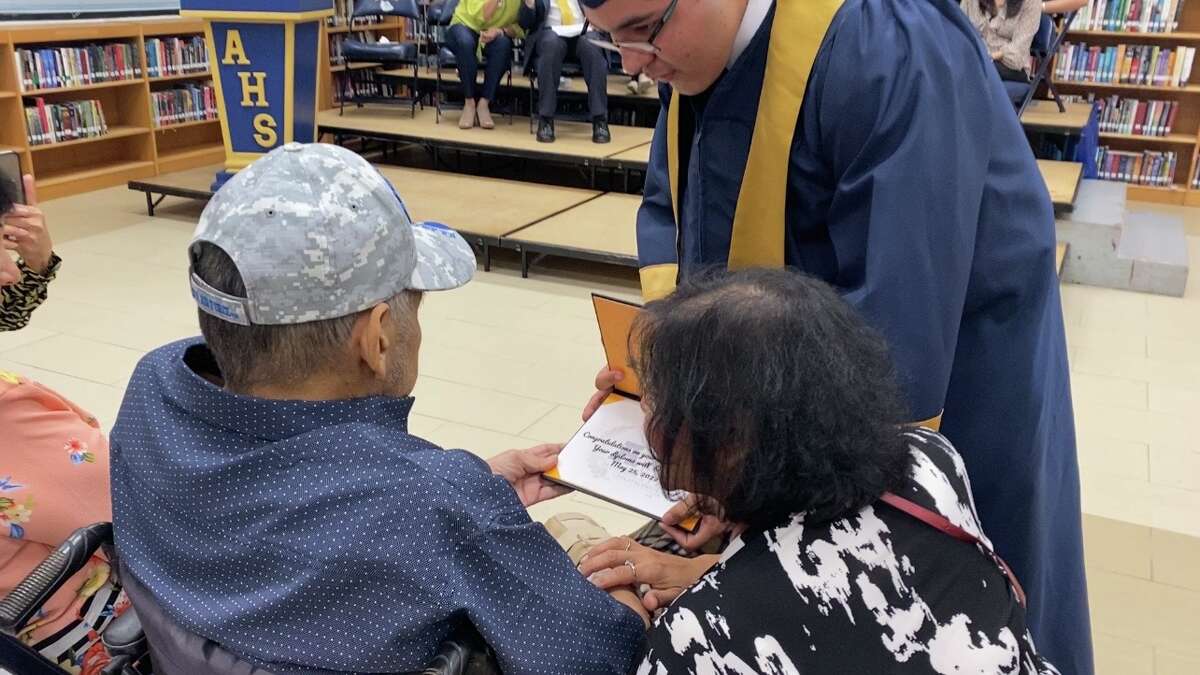 Alexander High School student Joshua Gonzalez has an early graduation ceremony for his father. April 13, 2022. 