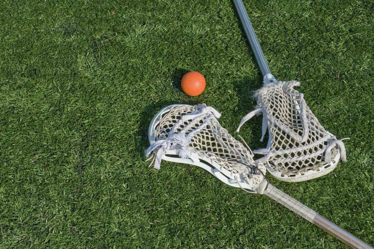 Lacrosse sticks and ball on artificial turf. Great for background.Please Also See: