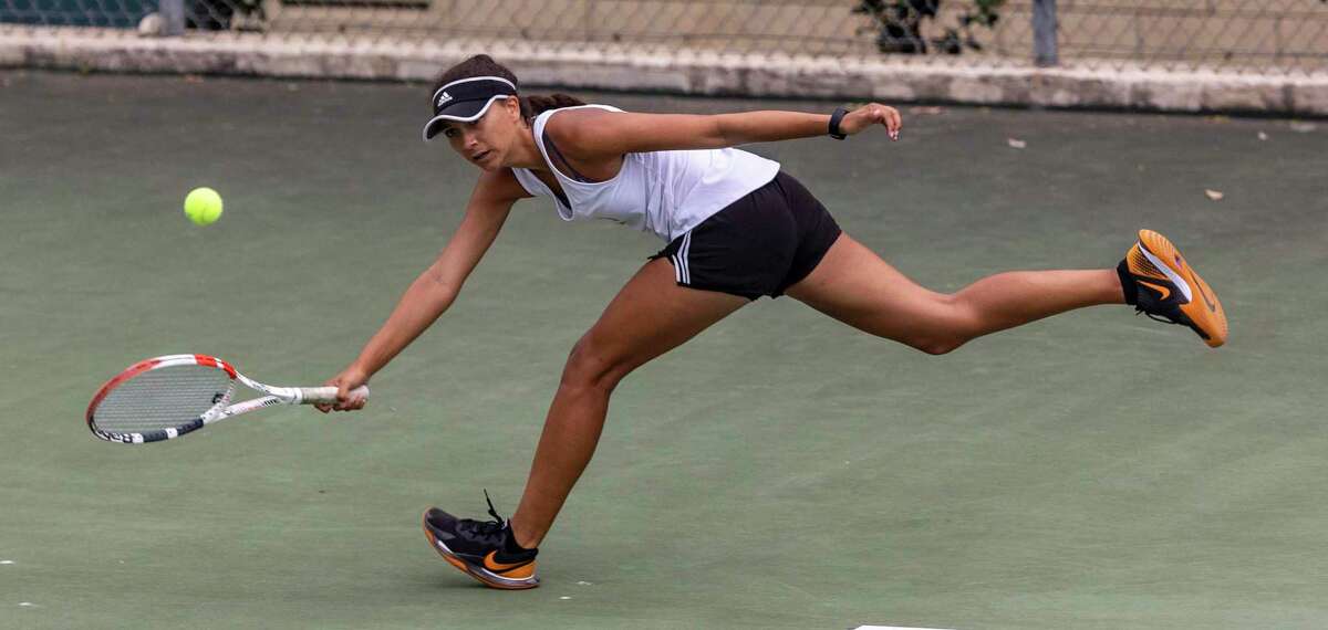 Madison’s Mya Bowe competes Wednesday, April 13, 2022, at the McFarlin Tennis Center in the Region IV-6A tennis championships with her sister Mattea Bowe in a doubles match against Westwood’s Simryn Jacob and Anwitha Duduka.