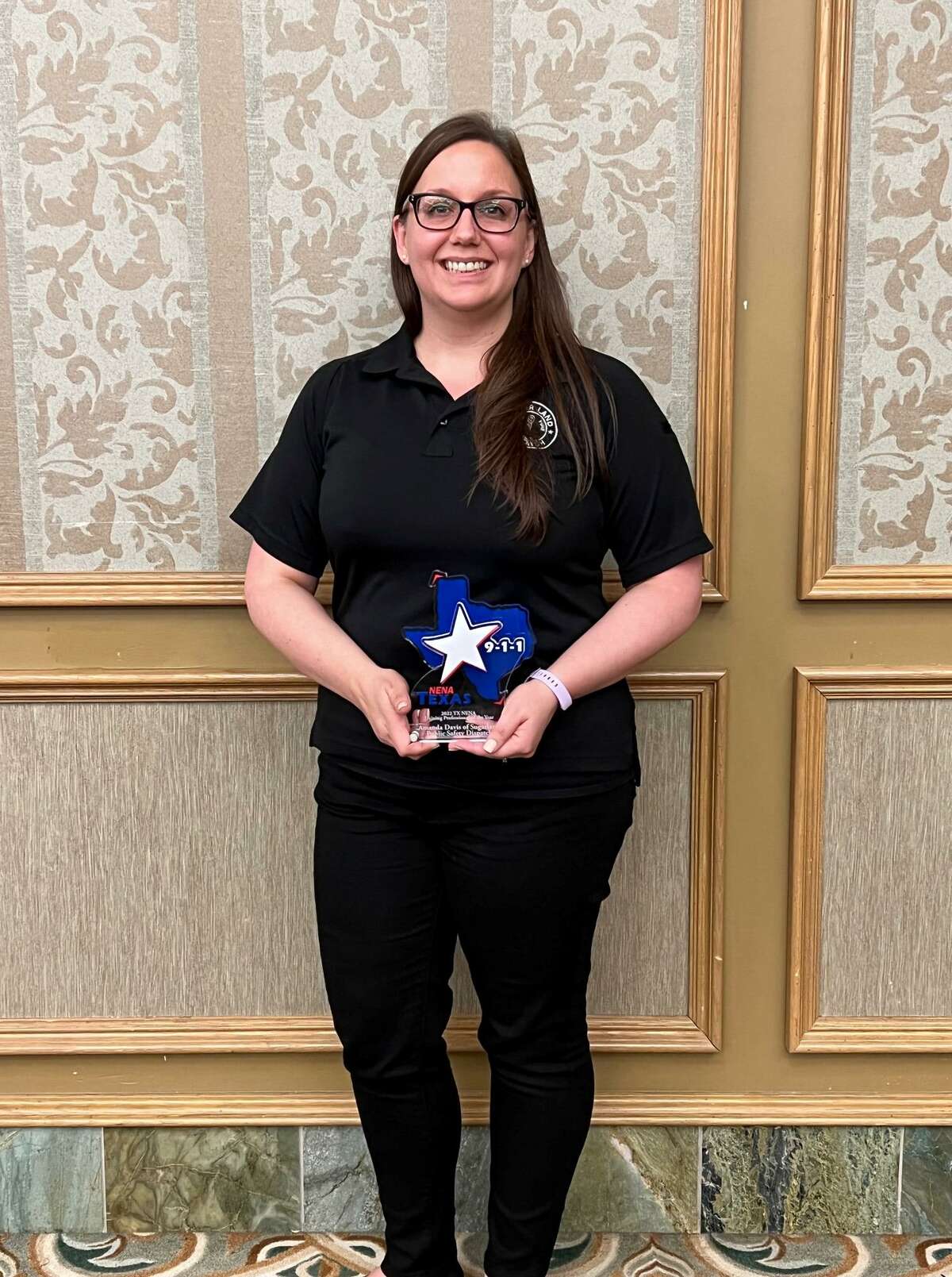Sugar Land Public Safety Dispatcher Amanda Davis was named the 2021 Training Professional of the Year by the Texas National Emergency Number Association.
