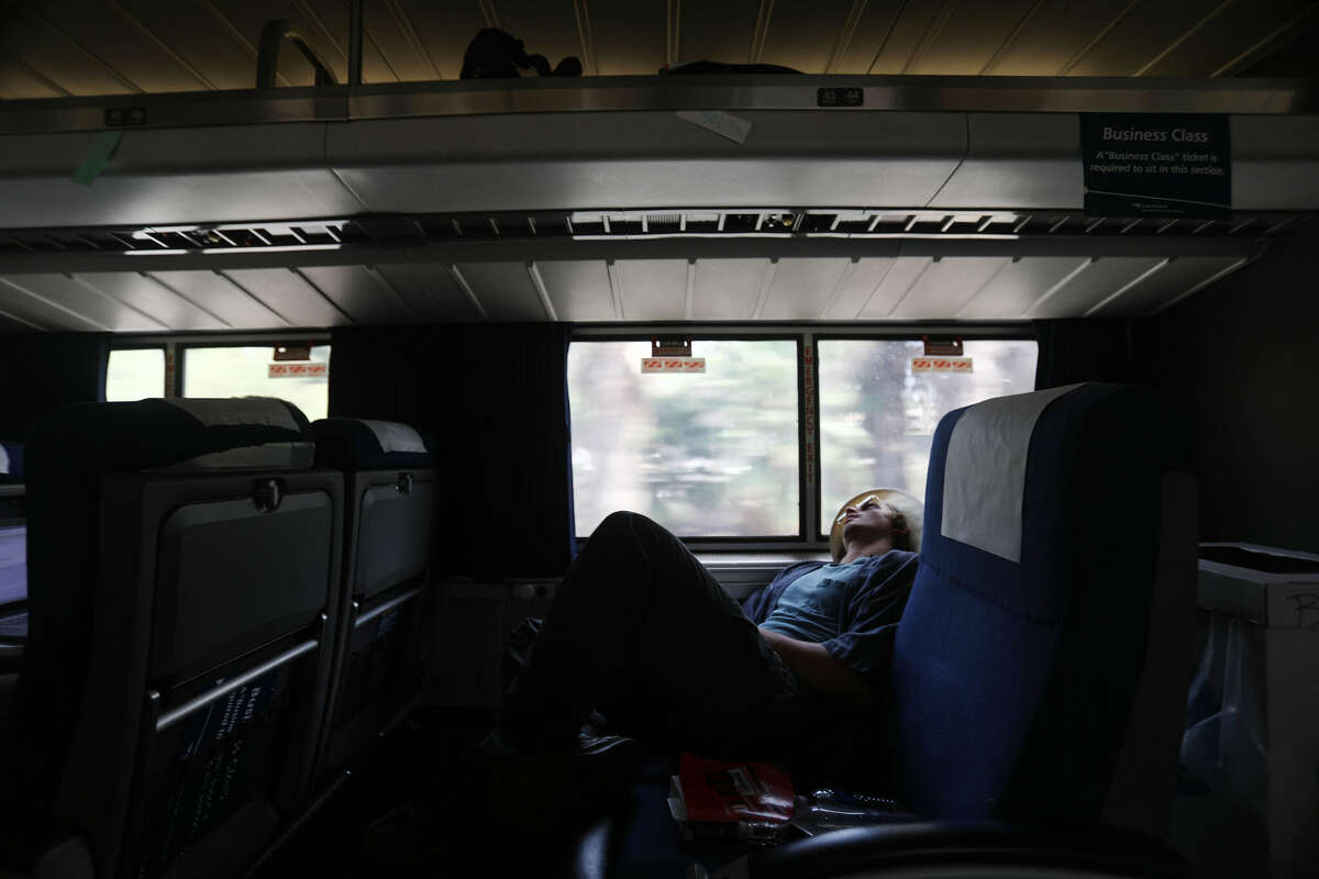 A man rides an Amtrak train in April 2018 in San Juan Capistrano, Calif.