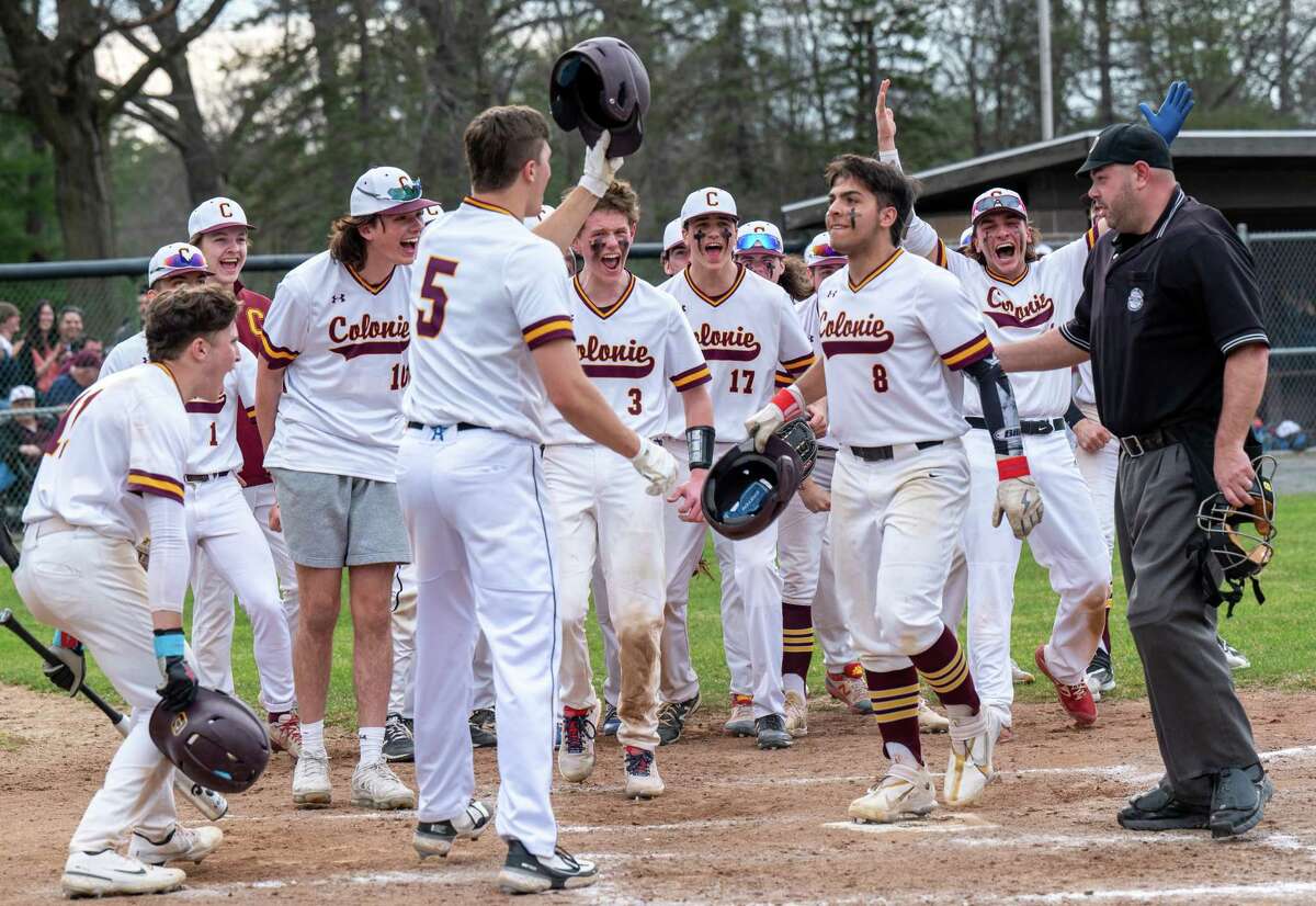 Colonie shortstop Daniel Barbero is greeted at the plate by his teammates after he hit a home run during a Suburban Council matchup against Christian Brothers academy at Cook Park in Colonie, NY, on Wednesday, April 13, 2022. (Jim Franco/Special to the Times Union)