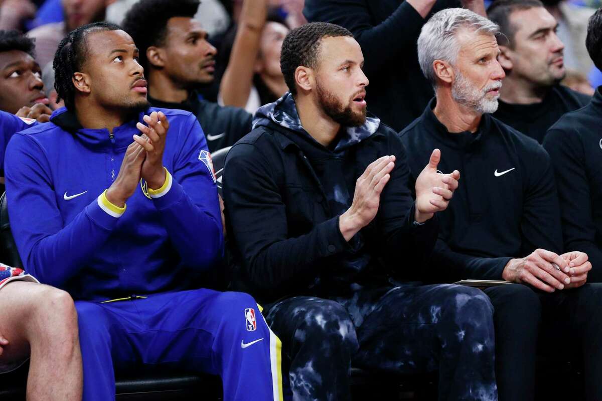 Golden State Warriors guard Stephen Curry (30) on the bench in the first half of an NBA game against the Utah Jazz at Chase Center, Saturday, April 2, 2022, in San Francisco, Calif. Curry is on the injured list.