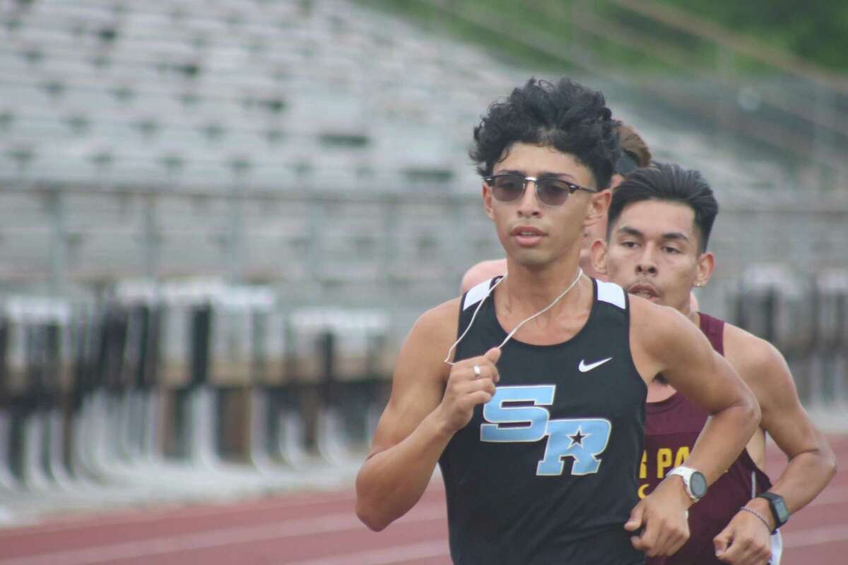 Rayburn's Jonathan Rivera holds a razor-thin lead heading into the final lap of the 3200-meter run Wednesday night. Rivera pulled away for the district crown, finishing in 9:55.
