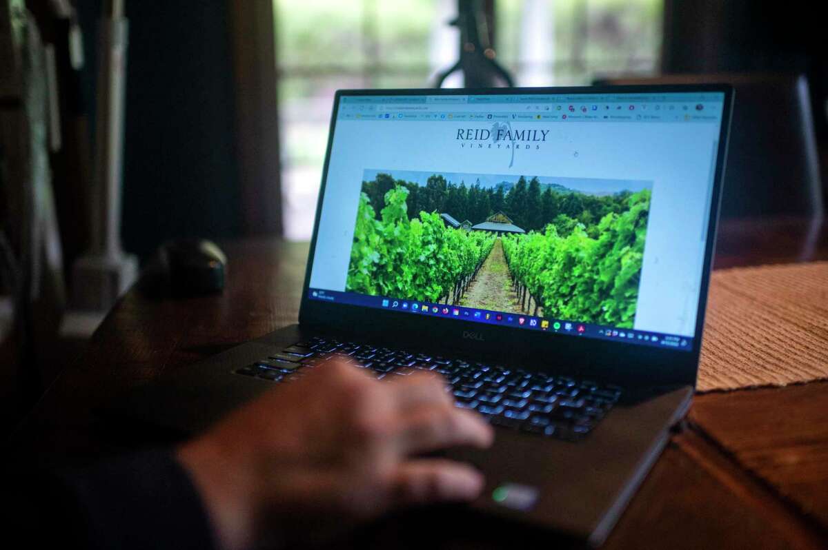 Kevin Reid, who suffers from multiple sclerosis and uses a wheelchair, works at his family winery, Reid Family Vineyards in Napa, Calif., Wednesday, April 13, 2022.