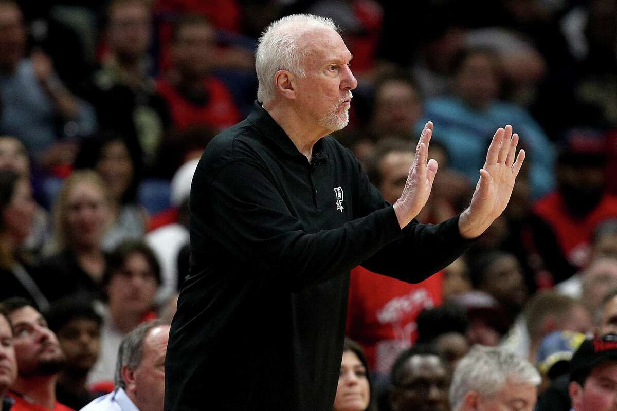 Coach Gregg Popovich of the San Antonio Spurs directs his team from the sideline during the first quarter of the play-in game against the Pelicans at Smoothie King Center on April 13, 2022, in New Orleans.