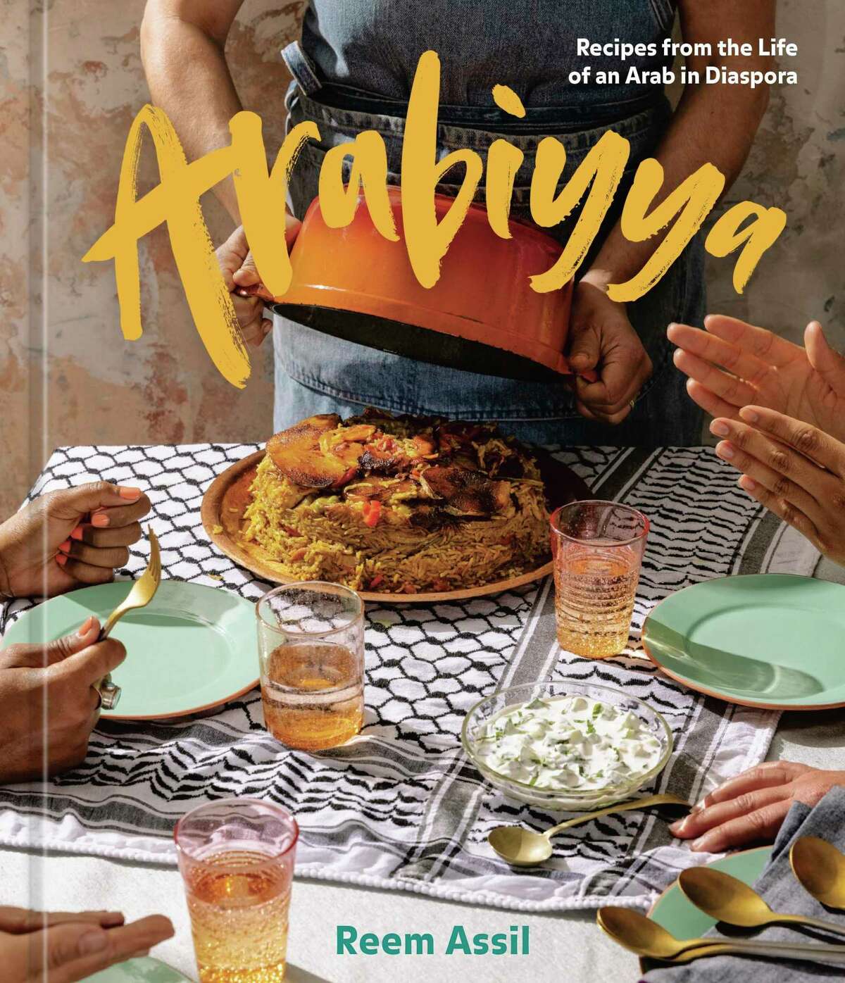 The cover of "Arabiyya: Recipes from the Life of an Arab in Diaspora" by Reem Assil.
