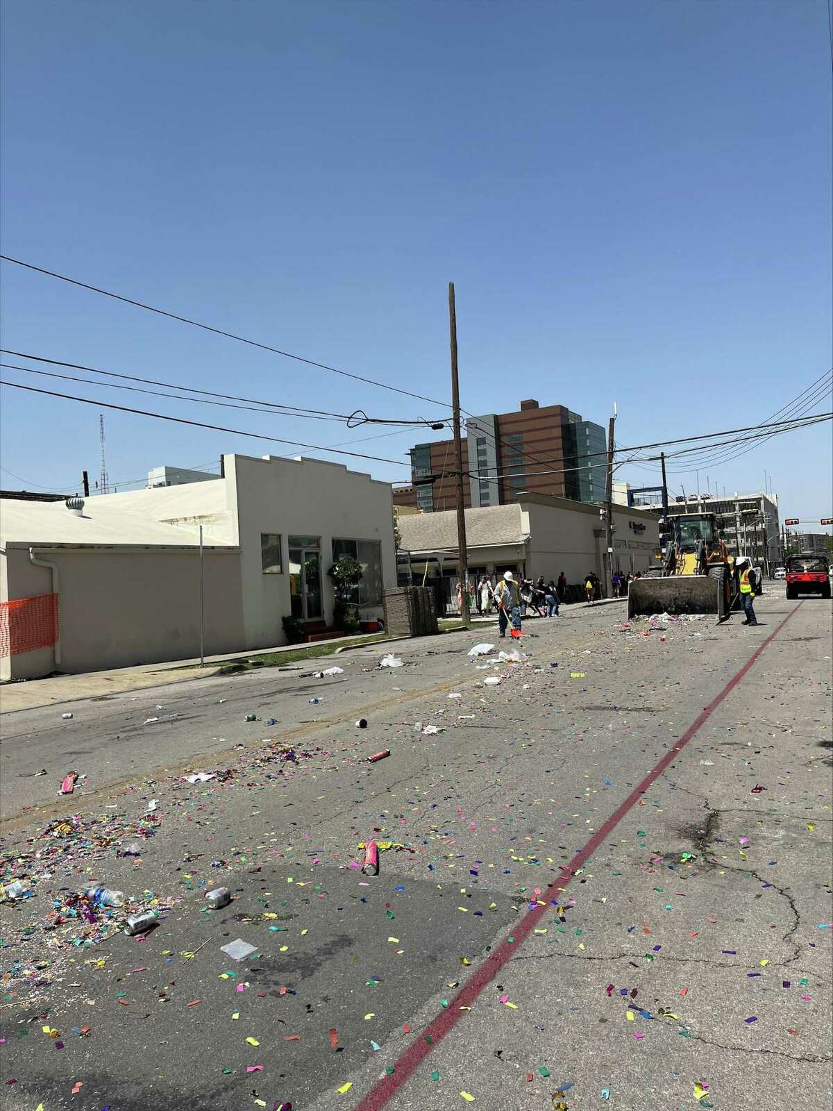 Public Works crews cleanup the streets after the Battle of Flowers, one of the main Fiesta events, on Friday, April 8.