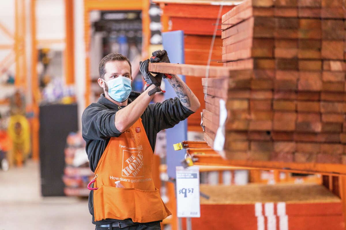 Employees at Home Depot stores. The home improvement retail chain said it is looking to hire over 300 employees for tis busy spring 2022 season.
