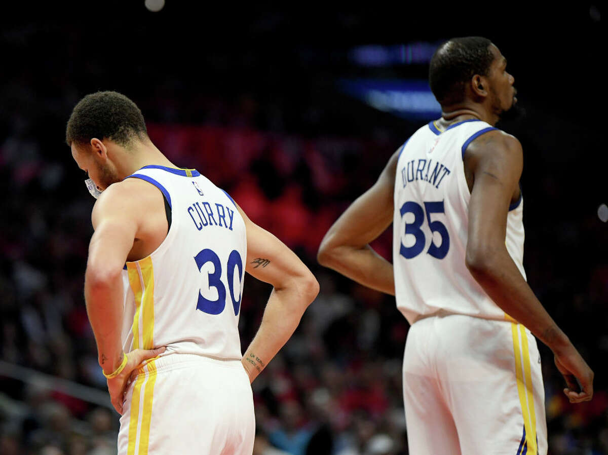 Stephen Curry and Kevin Durant of the Golden State Warriors in a 129-110 win over the Los Angeles Clippers during Game 6 of the first round of the 2019 NBA playoffs at the Staples Center on April 26, 2019, in Los Angeles. 