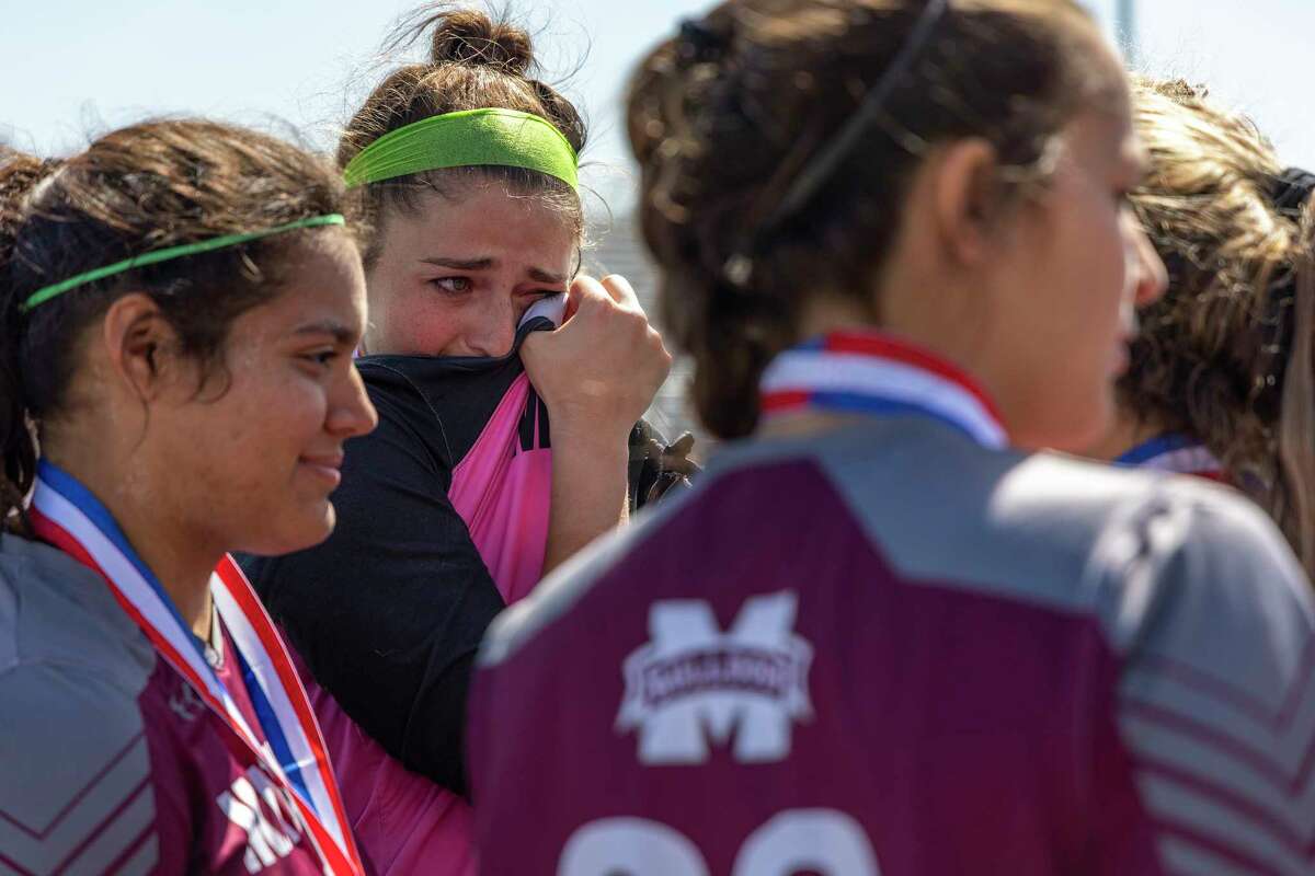Magnolia keeper Taylor Sanderson wipes away tears after falling 3-0 to Frisco Wakeland during a Class 5A girls soccer semifinal in Georgetown, Thursday, Apr., 14, 2022.