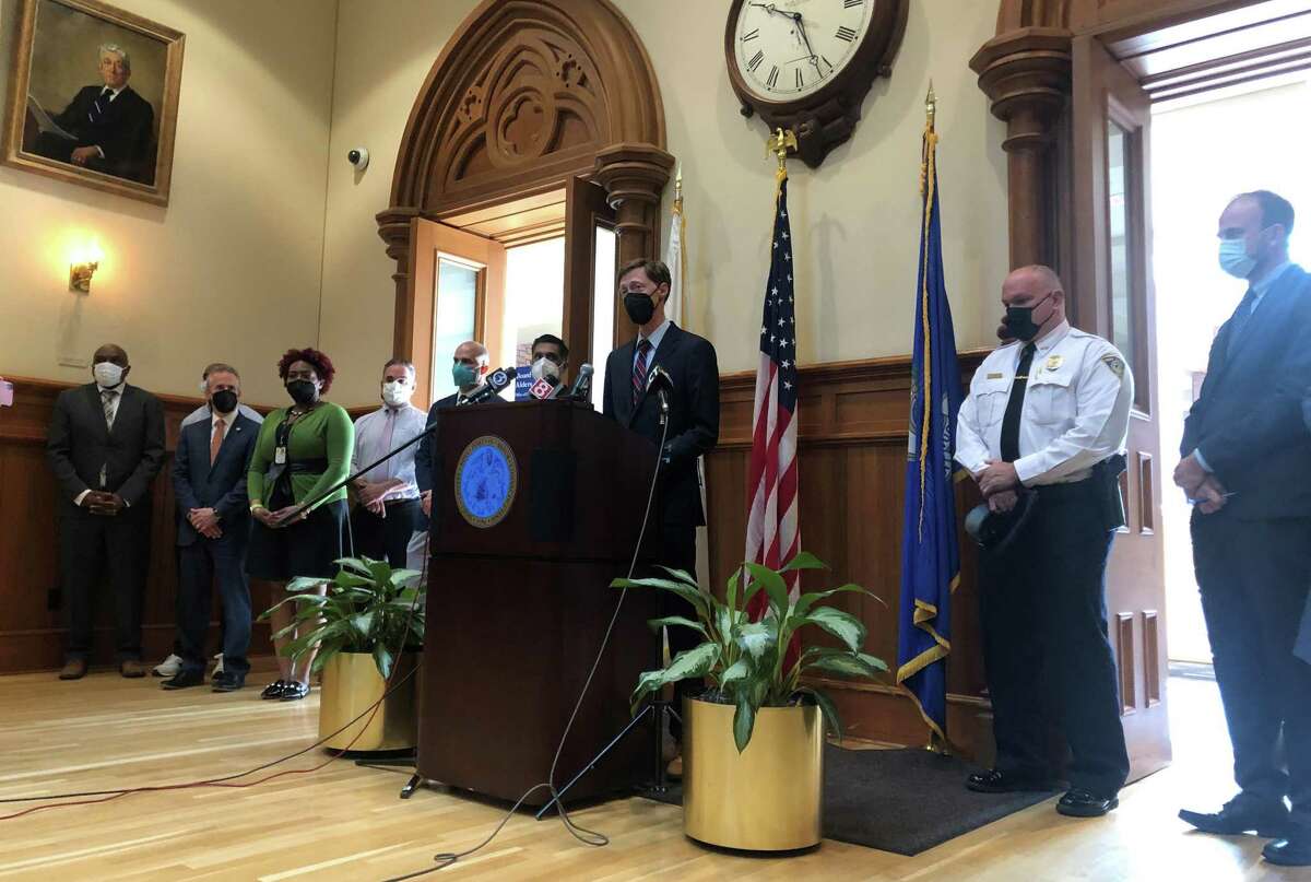 New Haven officials unveiled the PRESS initiative Thursday, which is designed to foster communication among antiviolence agencies and link people at risk of being involved in violence to services. Here, Mayor Justin Elicker speaks.