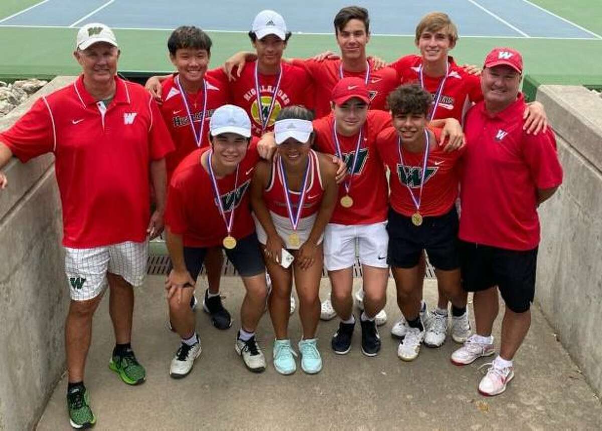 The Woodlands tennis’ eight medalists and the coaching staff pose for a photo after the Region II-6A tournament in Waco on Tuesday, April 12, 2022.