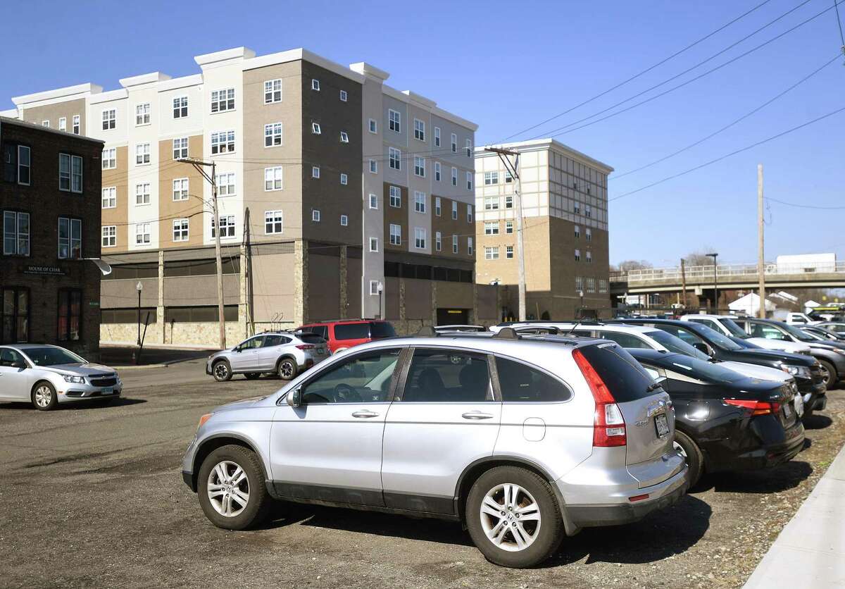The dirt parking lot on the site of the former Chromium Process company site on Canal Street in Shelton, Conn., on Friday, March 18, 2022.