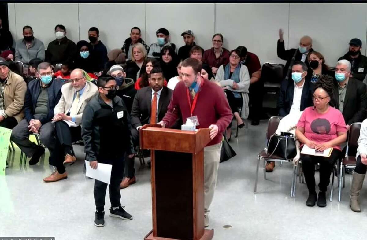 Park City Magnet School teacher Erik Johnson addresses the Bridgeport Board of Education during the public comment portion of the board’s meeting on April 11, 2022.