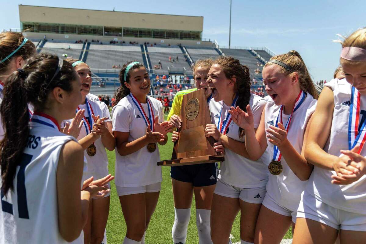 Boerne Champion’s Skyleigh Arnold holds the semifinal trophy after the Chargers lost to Grapevine 6-3 during a Class 5A girls soccer semifinal in Georgetown, Thursday, Apr., 14, 2022.