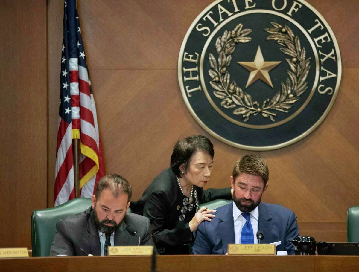 State Reps. Joe Moody, D-El Paso, left to right, Angie Chen Button, R-Richardson, and Jeff Leach, R-Plano, arrive for the Interim Study Committee on Criminal Justice Reform hearing about death row inmate Melissa Lucio at the Capitol, in Austin, Texas, on Tuesday, April 12, 2022. A bipartisan majority of the Texas House of Representatives is calling for clemency for Melissa Lucio who was convicted of capital murder in 2008 after the death of her daughter. (Jay Janner/Austin American-Statesman via AP)