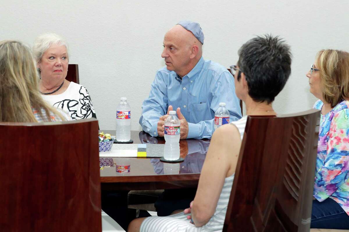 Some of the founders of a new conservative synagogue for the Montgomery County area, facing from left, Betty Friedman, Daniel Schmulnon and Sheryl Riffle gather at one of their homes to talk about the new congregation Tuesday, Apr. 12, 2022 in Conroe, TX. They currently hold services at a local community center, but are looking for a permanent brick an mortar location.