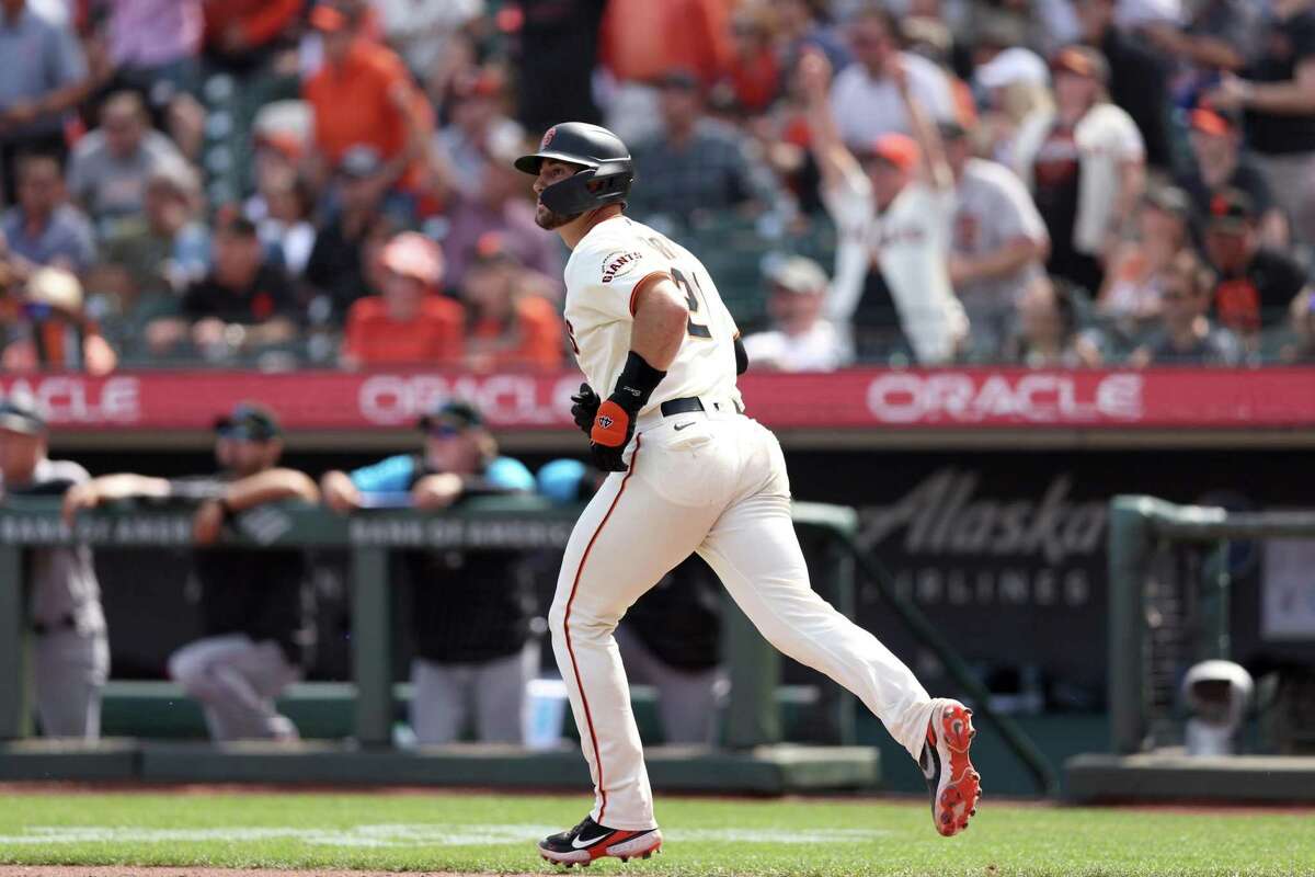 SAN FRANCISCO, CALIFORNIA - APRIL 08: Joey Bart #21 of the San Francisco Giants watches his home run ball go over the fence in the fifth inning against the Miami Marlins during their opening day game at Oracle Park on April 08, 2022 in San Francisco, California. (Photo by Ezra Shaw/Getty Images)