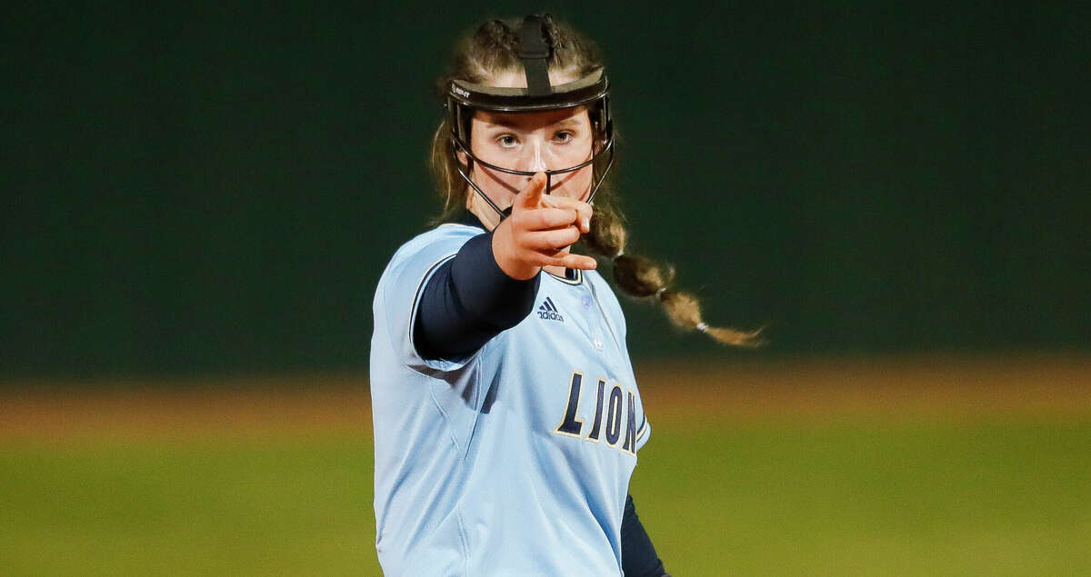 Lake Creek starting pitcher Ava Brown (22) points back toward catcher Kalee Rochinski after a strikeout during the fourth inning of a high school softball game at Lake Creek High School, Wednesday, March 9, 2022, in Montgomery.
