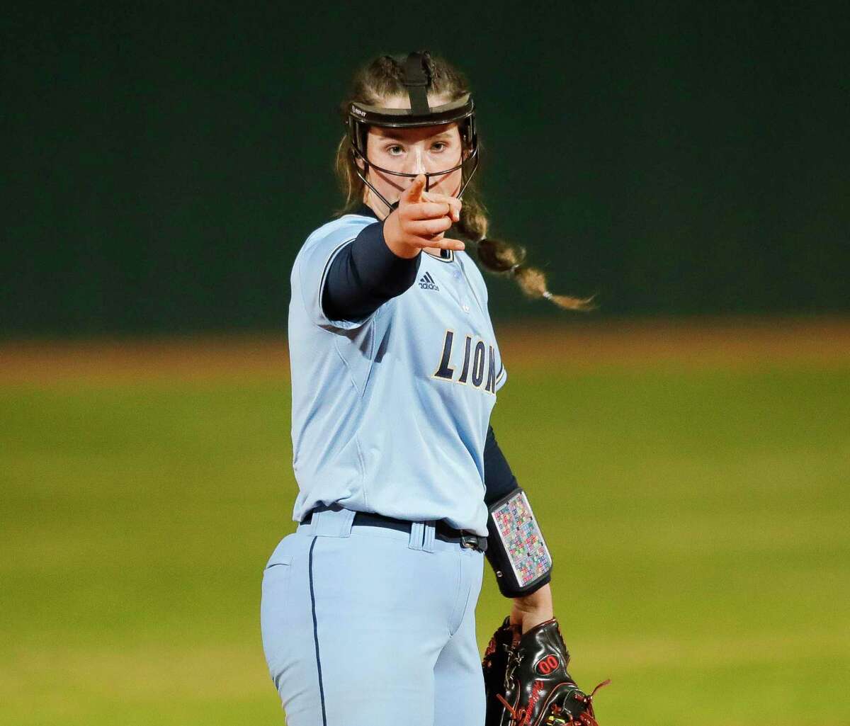 Lake Creek starting pitcher Ava Brown (22), shown here last month, tossed a perfect game Thursday night at Kingwood Park.