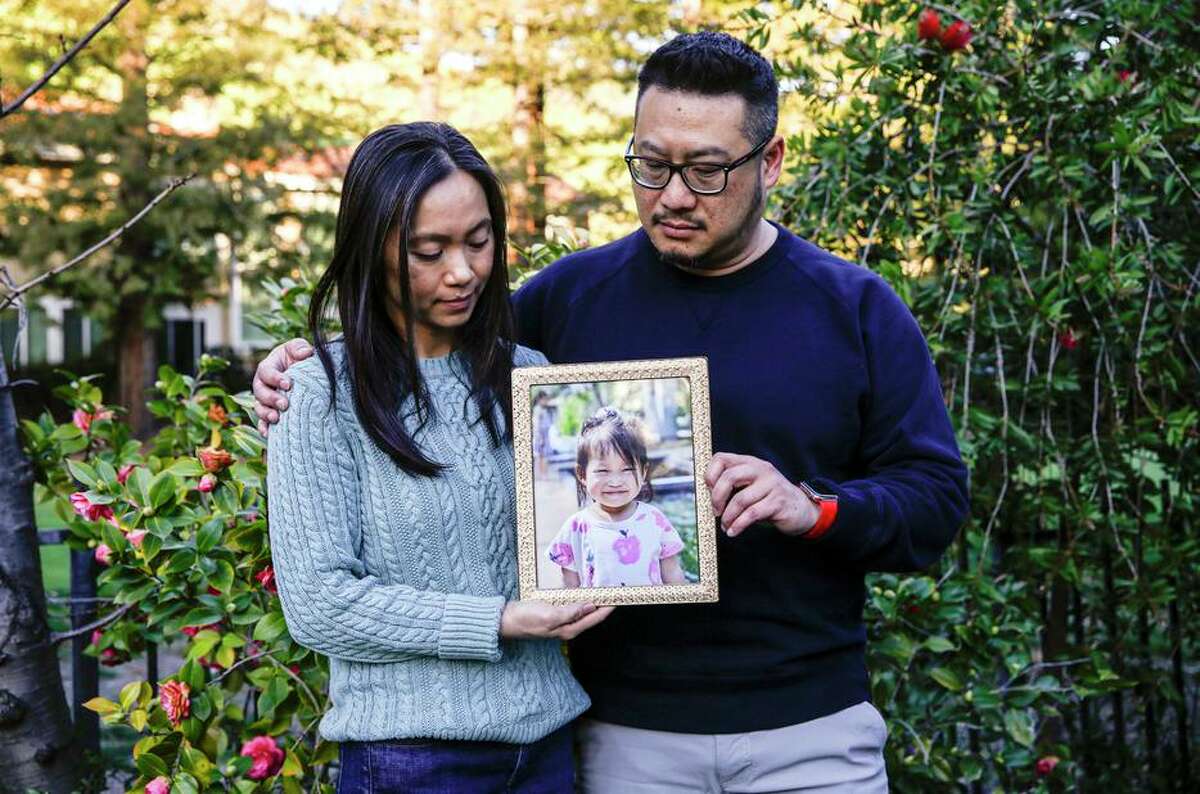 Truc-Co and Tom Jong hold a picture of their daughter Ailee, 2, who died at John Muir Medical Center in Walnut Creek.