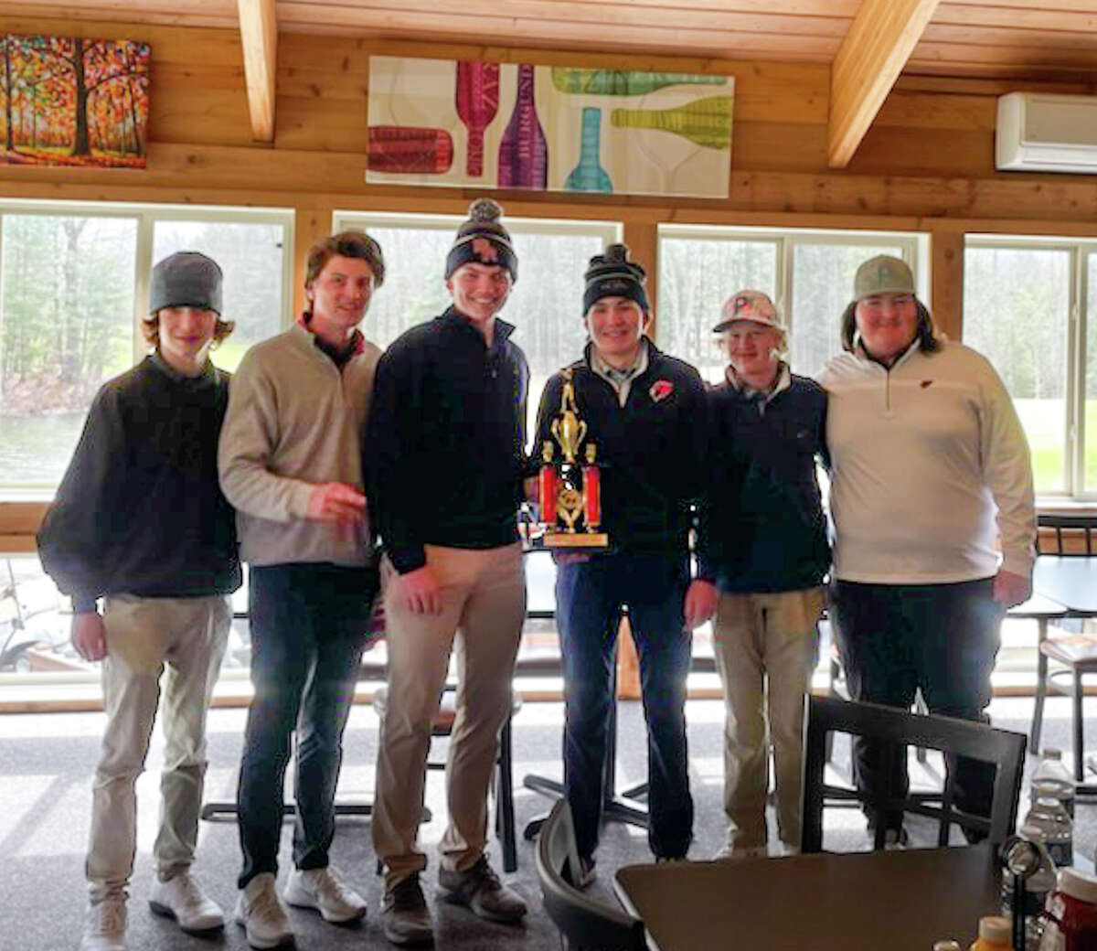 Big Rapids boys golf team celebrates Thursday's championship win at Canadian Lakes.