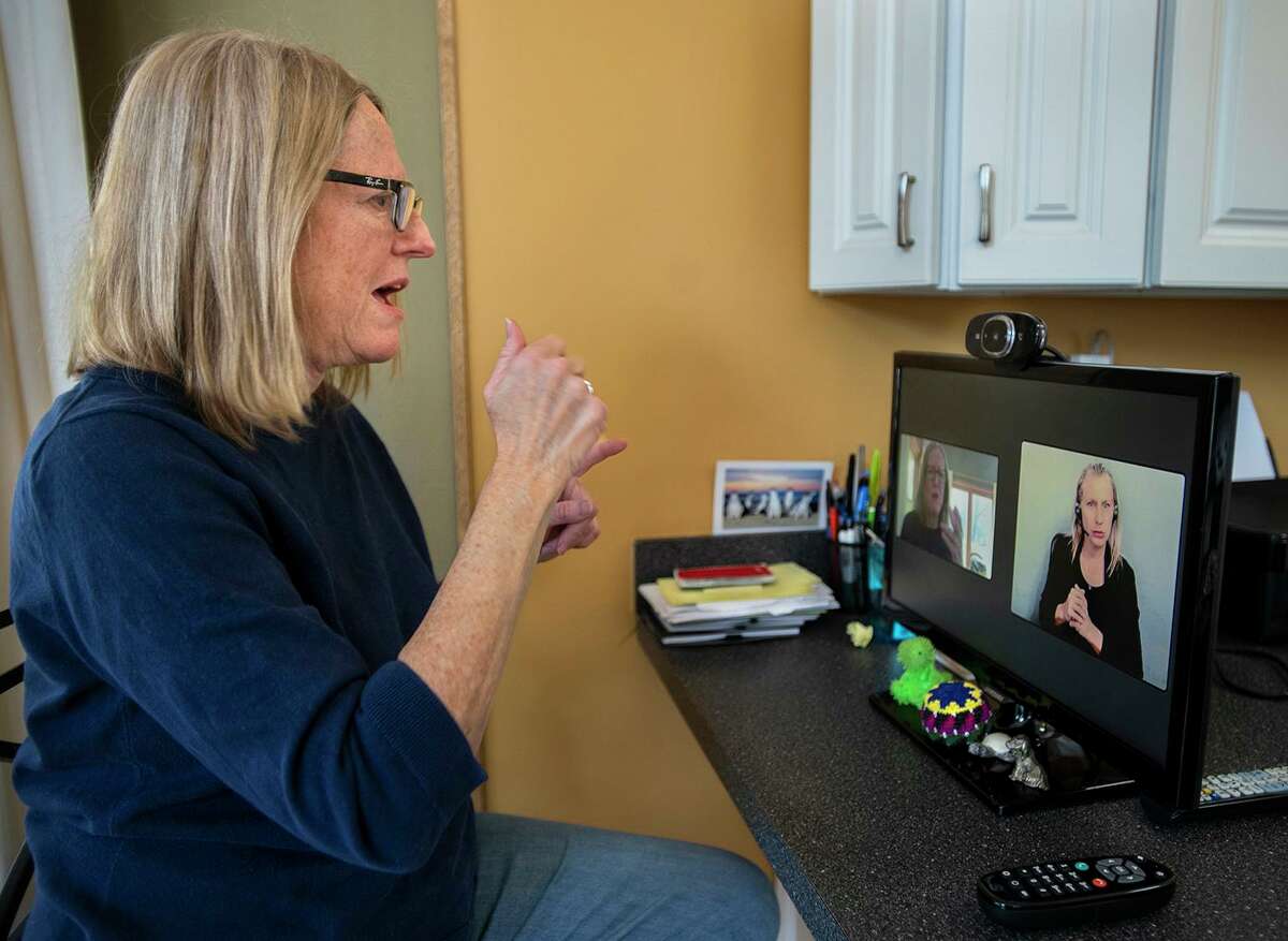 Doreen Simons uses a video remote Interpreting (VRI) service from her Farmington home. Simmons is deaf.