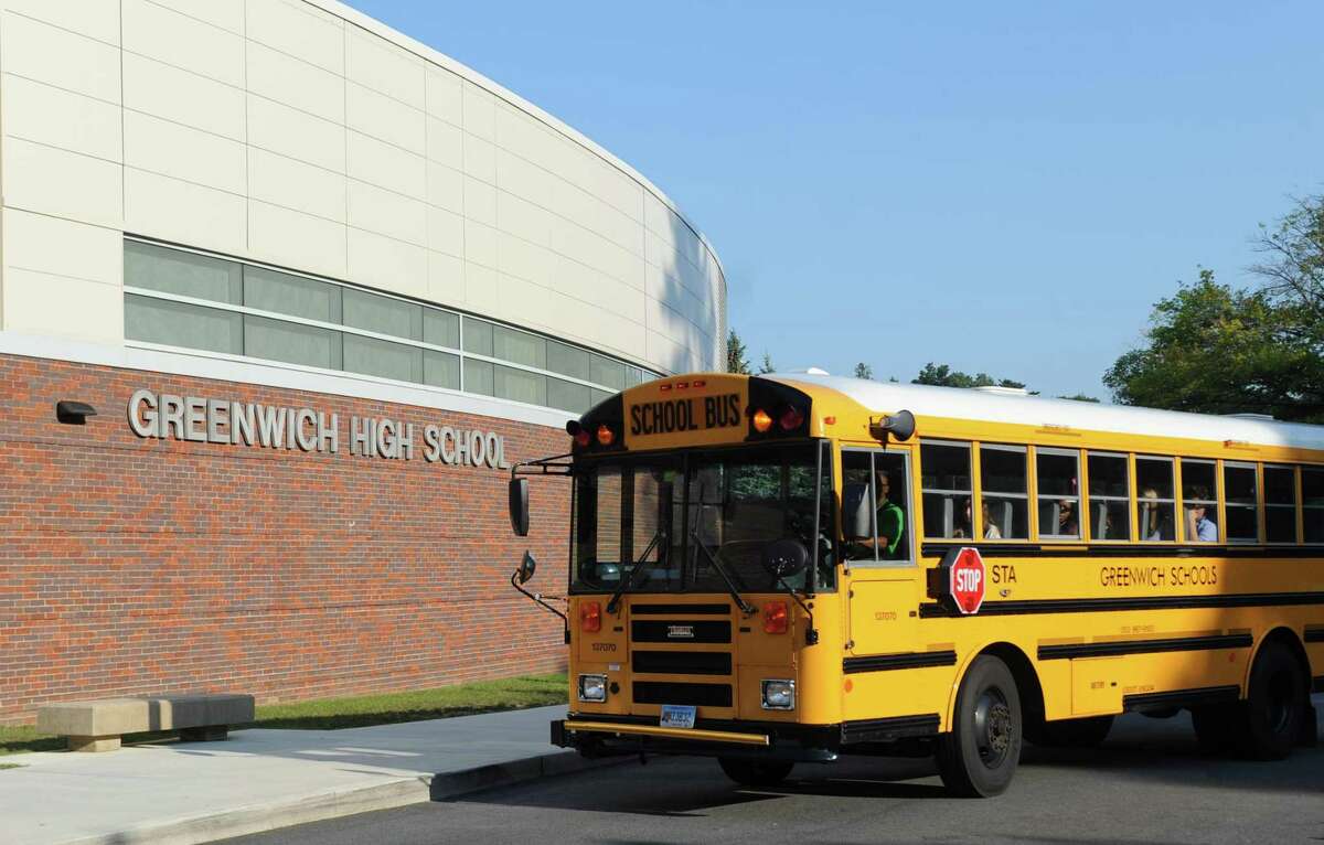 A school bus turns into GHS on the first day of the 2017-2018 school year at Greenwich High School in Greenwich on Aug. 31, 2017.