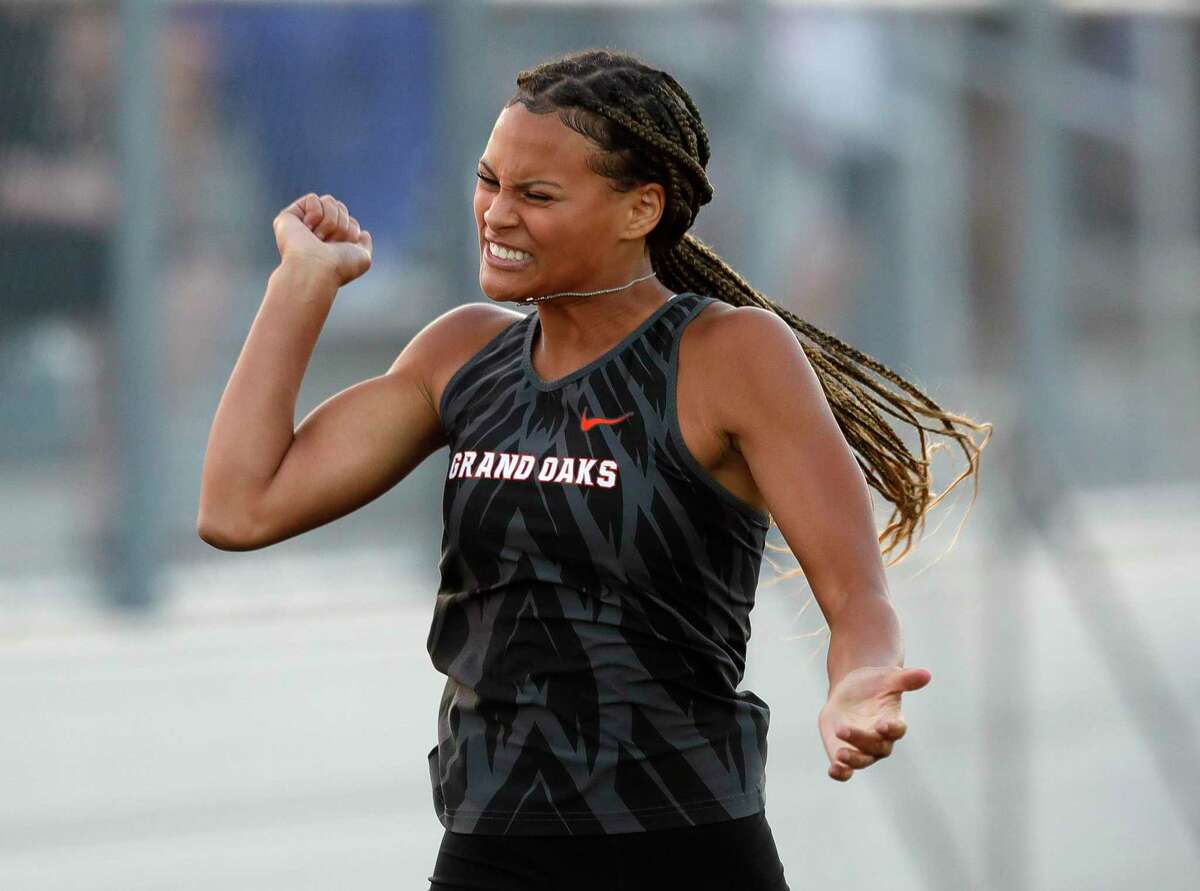 Grand Oak’s Lillian Harden reacts after finishing first in the women’s 300-meter hurdles during the District 13-6A Track and Field Championships at Grand Oaks High School, Thursday, April 14, 2022, in Spring.
