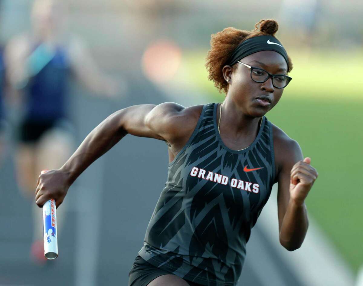Grand Oaks’ Kirsten Young track competes in the women’s 800-meter relay during the District 13-6A Track and Field Championships at Grand Oaks High School, Thursday, April 14, 2022, in Spring.