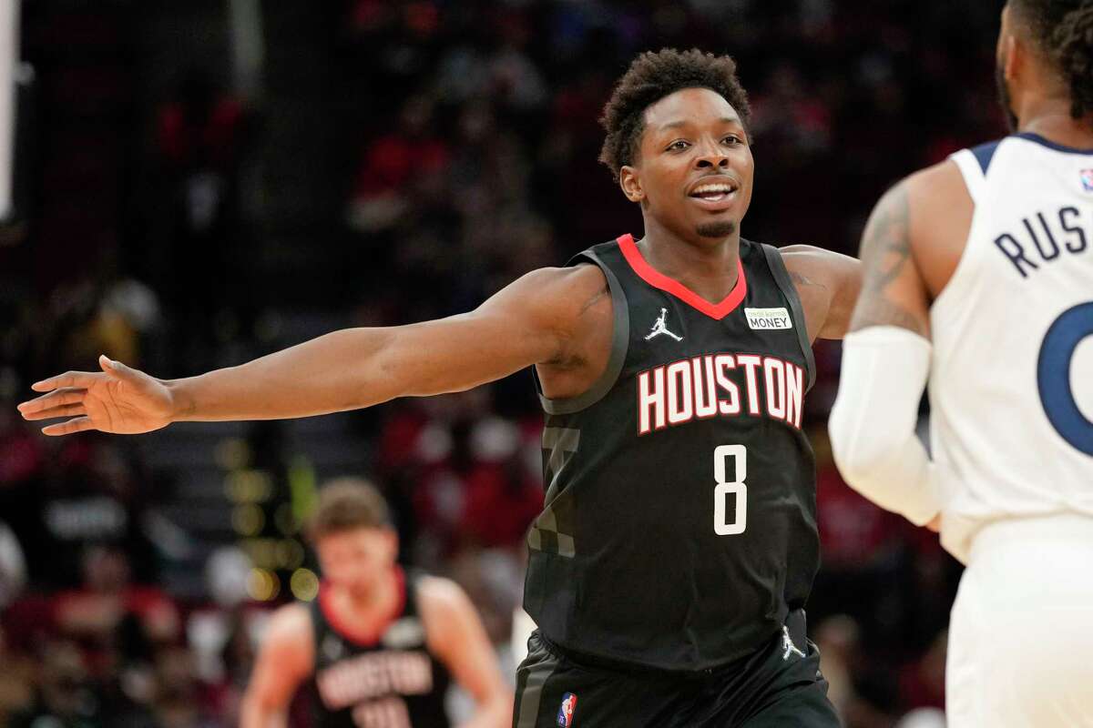 Houston Rockets forward Jae'Sean Tate (8) reacts after making a 3-point basket during the first half of an NBA basketball game against the Minnesota Timberwolves, Sunday, April 3, 2022, in Houston. (AP Photo/Eric Christian Smith)
